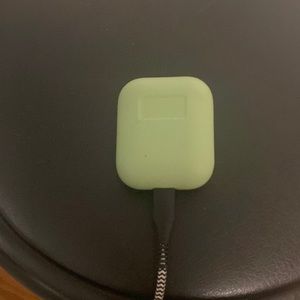 Used AirPods (2nd Generation). Green silicone case is included.